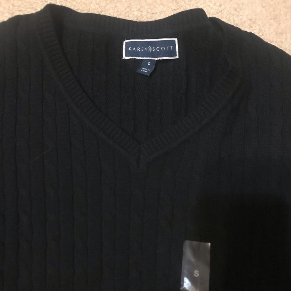 Woman’s black sweater